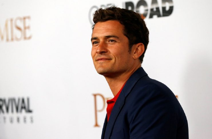 Actor Bloom poses at the premiere of “The Promise” in Los Angeles