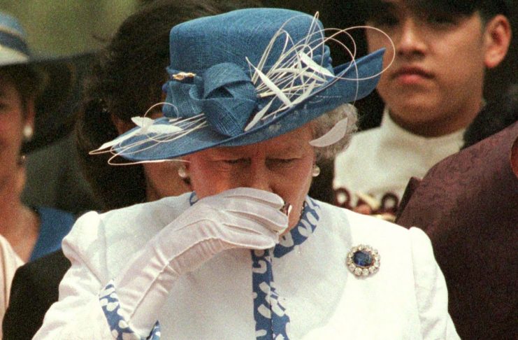 With a birthday feast of rice cakes and fruit in front of her,  Britain’s Queen Elizabeth II drinks ..