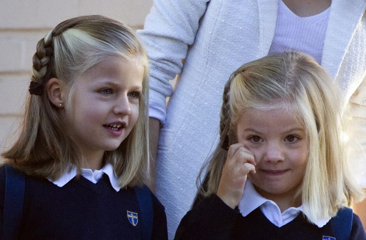 Spanish Infanta Sofia and her sister Infanta Leonor pose as they arrive at school during the Infantas’ first week of class in Aravaca