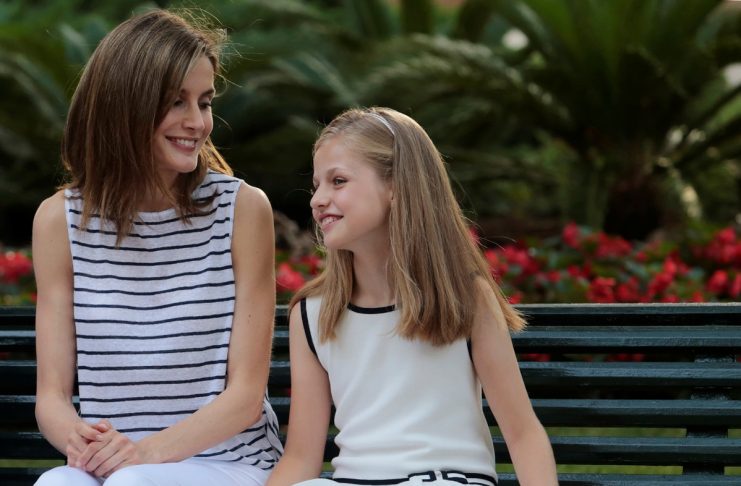 Spain’s Queen Letizia looks at her daughter Princess Leonor during a photocall in the gardens of the Marivent Palace in Palma de Mallorca