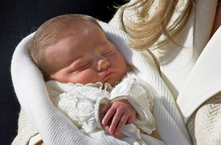 Spain’s new born Infanta Leonor sleeps in the arms of her mother Princess Letizia as they leave hosp..
