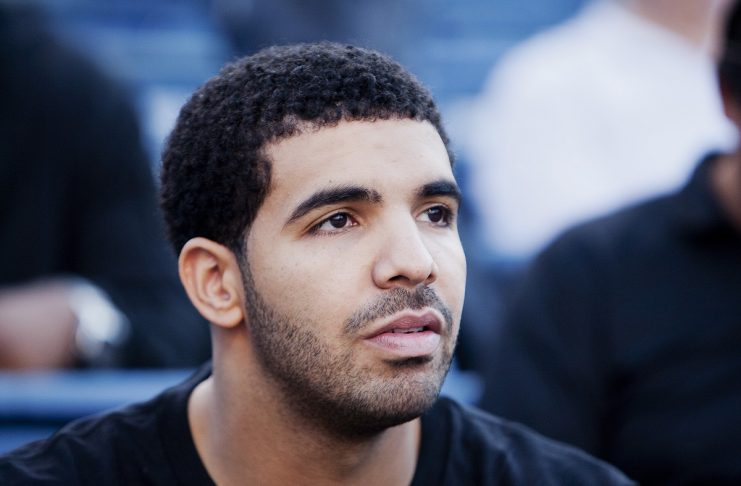 Canadian rapper Drake watches the third round match of WIlliams of the U.S. and Zheng of China during the Rogers Cup women’s tennis tournament in Toronto