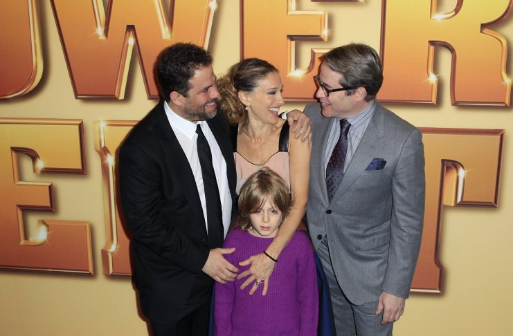 Matthew Broderick laughs with director Brett Ratner as he arrives with his wife Sarah Jessica Parker and son James Wilkie Broderick for the premiere of “Tower Heist” in New York