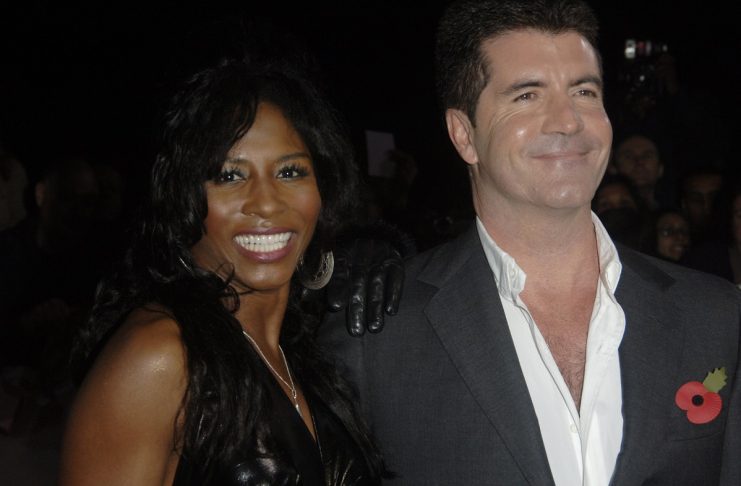 Singer Sinitta and Simon Cowell pose at the “National Television Awards” in London