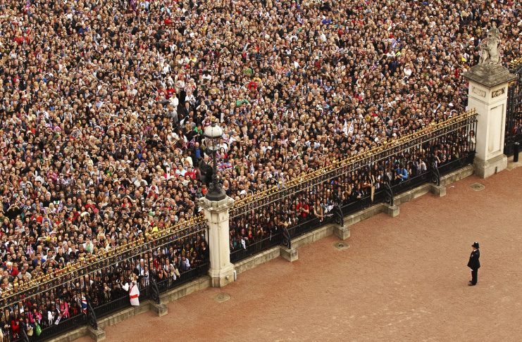 Crowds gather on the Mall, in front of Buckingham Palace, after the royal wedding of Britain’s Prince William to Catherine, Duchess of Cambridge at Westminster Abbey, in central London