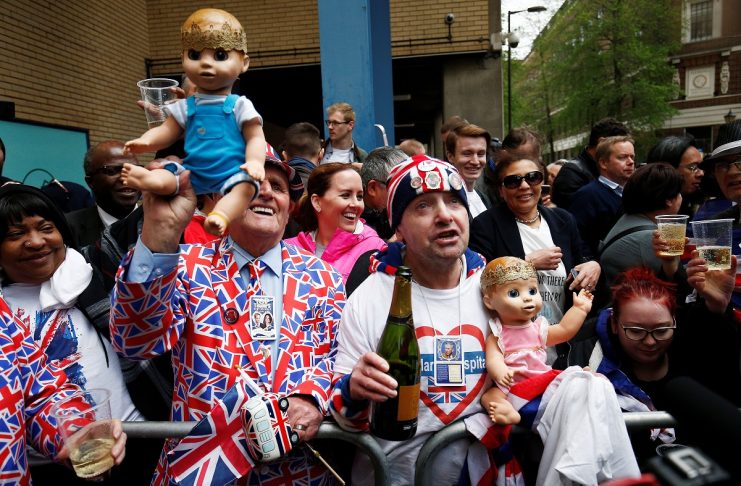 Two supporters of the royal family holding dolls wearing crowns celebrate outside the Lindo Wing of St Mary’s Hospital after Britain’s Catherine, the Duchess of Cambridge, gave birth to a son, in London