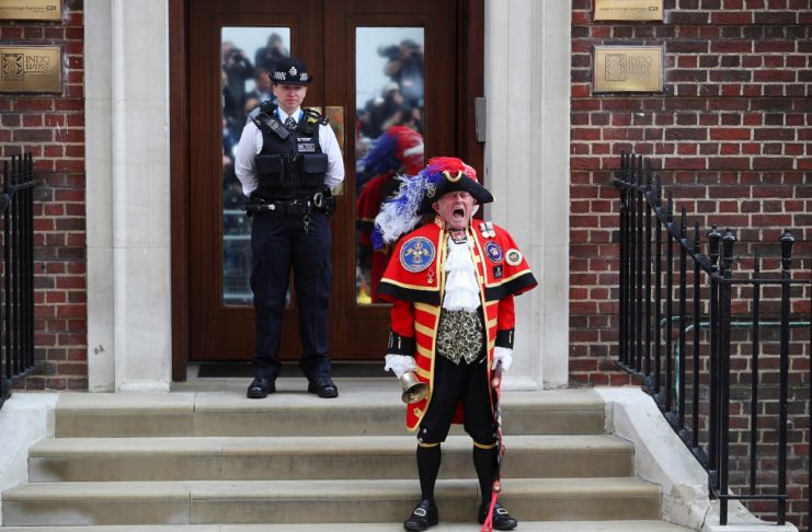 A man dressed as a town crier shouts outside the Lindo Wing of St Mary’s Hospital after Britain’s Catherine, the Duchess of Cambridge, gave birth to a son, in London