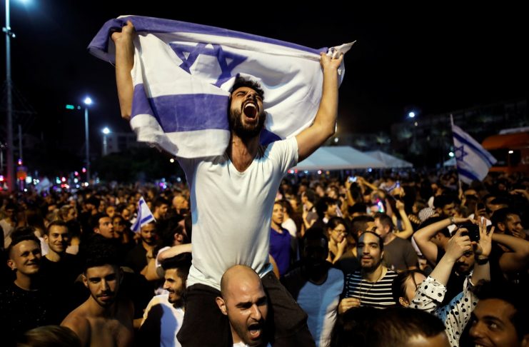 People celebrate the winning of the Eurovision Song Contest 2018 by Israel’s Netta Barzilai with her song “Toy” , Rabin square in Tel Aviv Israel