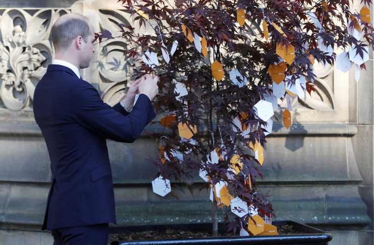 Britain’s Prince William leaves a tribute message as he leaves a memorial service on the first anniversary of the Manchester Arena bombing, in Manchester