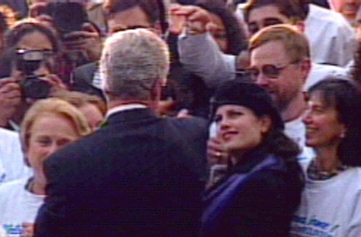 FILE PHOTO 6NOV96 – Former White House intern Monica Lewinsky looks at President Clinton at the Whit..