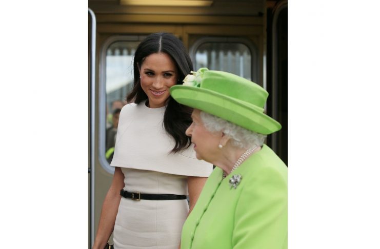 Britain’s Queen Elizabeth and Meghan, the Duchess of Sussex, arrive in Runcorn