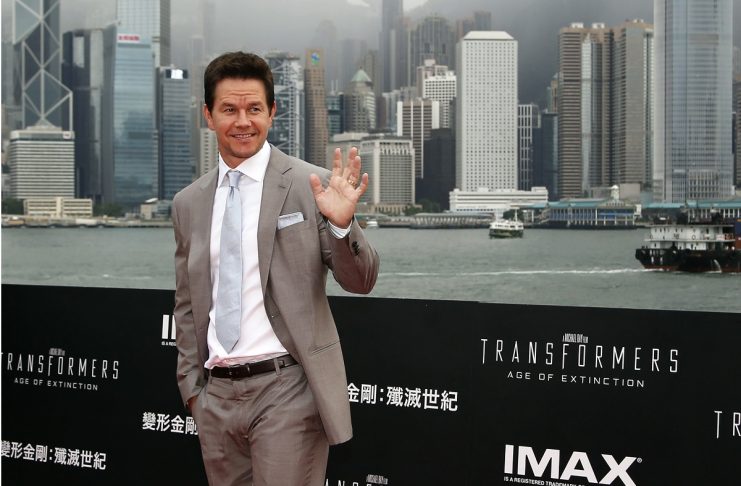 U.S. actor Mark Wahlberg poses on the red carpet as he arrives for the world premiere of the film “Transformers: Age of Extinction” in Hong Kong