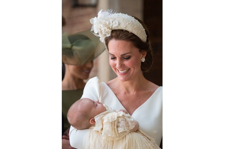 Britain’s Catherine, the Duchess of Cambridge, carries Prince Louis as they arrive for his christening service at the Chapel Royal, St James’s Palace, London