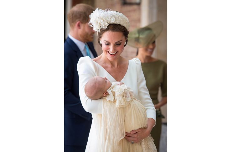 Britain’s Catherine, the Duchess of Cambridge, carries Prince Louis as they arrive for his christening service at the Chapel Royal, St James’s Palace, London