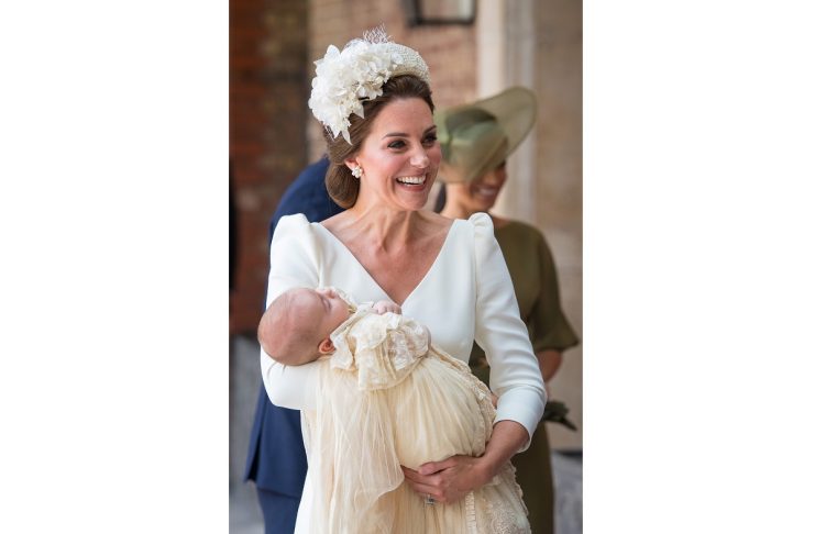 Britain’s Catherine, the Duchess of Cambridge, carries Prince Louis as they arrive for his christening service at the Chapel Royal, St James’s Palace, London