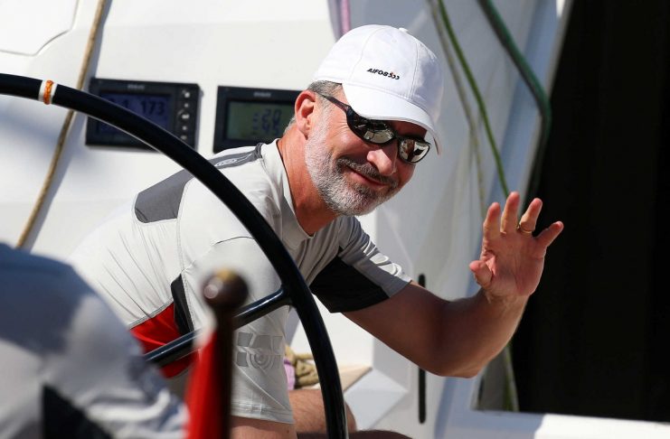 Spain’s King Felipe VI waves aboard the “Aifos” yacht during the 37th King’s Cup yachting race in Palma de Mallorca