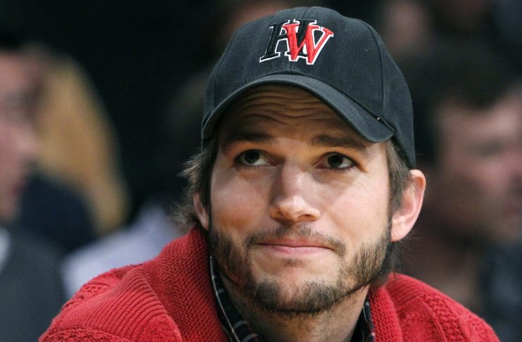 Ashton Kutcher sits courtside during the Los Angeles Lakers against Denver Nuggets NBA playoff game in Los Angeles