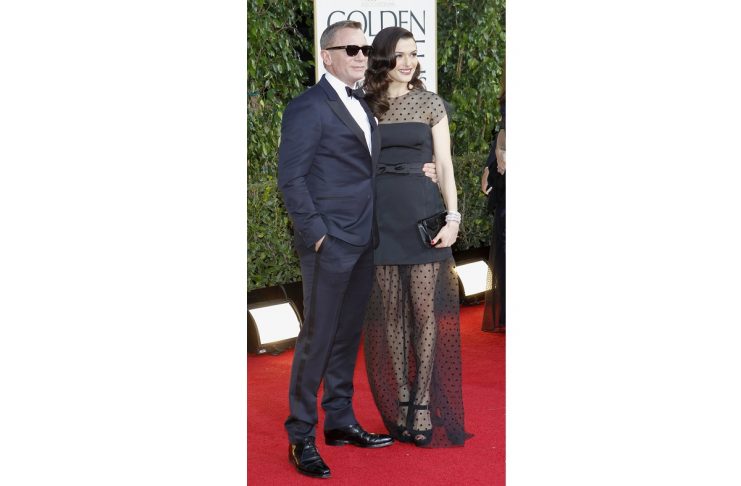 Actor Daniel Craig and his wife, actress Rachel Weisz, arrive at the 70th annual Golden Globe Awards in Beverly Hills