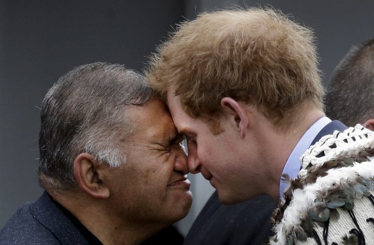Britain’s Prince Harry exchanges a hongi with a Maori elder after his welcome to Putiki marae during his visit to Whanganui