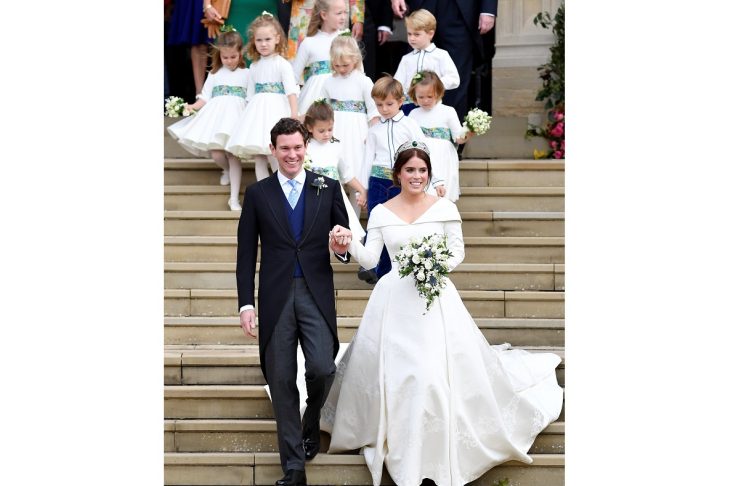 Britain’s Princess Eugenie of York and her husband Jack Brooksbank leave after their wedding at St George’s Chapel in Windsor Castle, Windsor