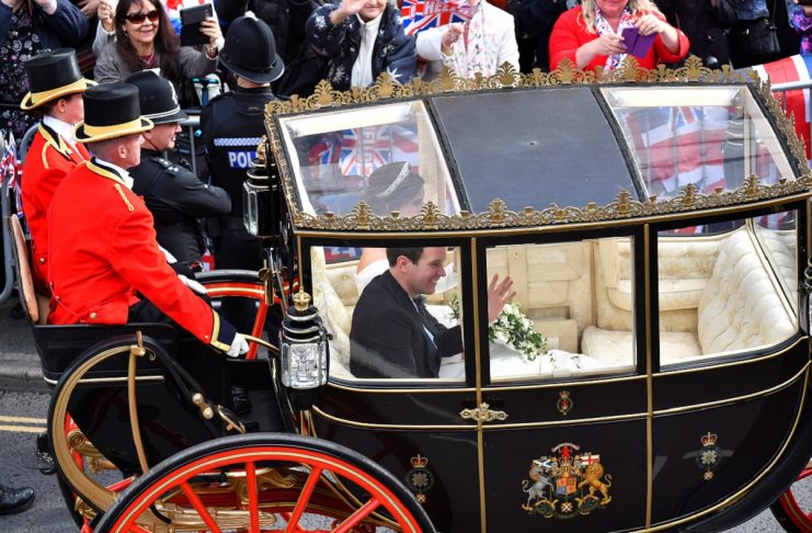 Britain’s Princess Eugenie of York and her husband Jack Brooksbank leave in a carriage after their wedding ceremony at Windsor Castle, Windsor