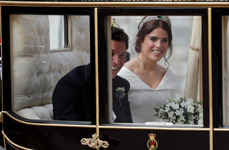 Britain’s Princess Eugenie of York and her husband Jack Brooksbank leave in a carriage after their wedding ceremony at Windsor Castle, Windsor