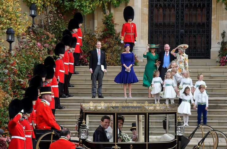 Britain’s Princess Eugenie of York and her husband Jack Brooksbank leave in a carriage after their wedding ceremony at Windsor Castle, Windsor