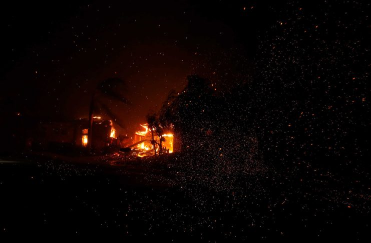 A home burns during a wildfire that claimed dozens of homes in Thousand Oaks