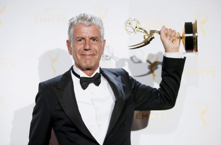 Anthony Bourdain poses with the outstanding informational series or special award for “Anthony Bourdain Parts Unknown” backstage at the 2015 Creative Arts Emmy Awards in Los Angeles