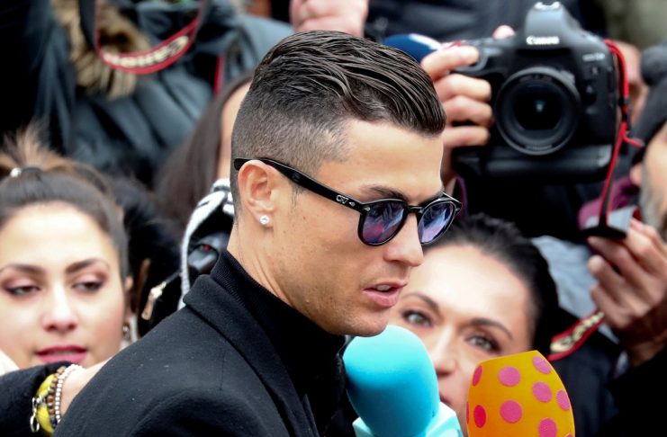 Portugal’s soccer player Cristiano Ronaldo leaves after appearing in court on a trial for tax fraud in Madrid