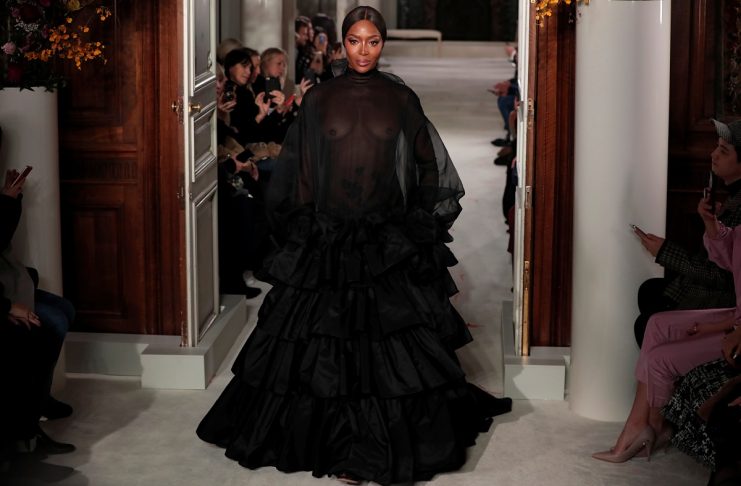 Model Naomi Campbell presents a creation by Italian designer Pier Paolo Piccioli as part of his Haute Couture Spring-Summer 2019 collection show for fashion house Valentino in Paris