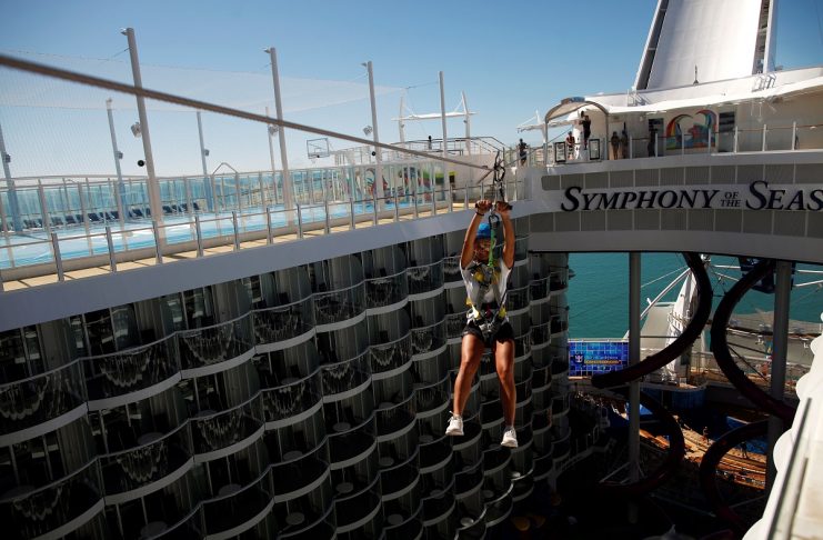 Girl ziplines on Symphony of the Seas during its world presentation ceremony at Malaga port