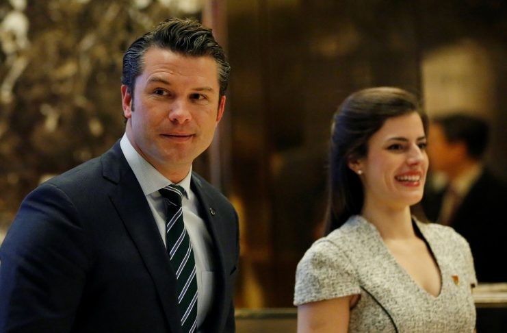 Pete Hegseth, former executive director of Vets For Freedom, looks at the media members while waiting for the escalator in the lobby of Trump Tower in Manhattan, New York