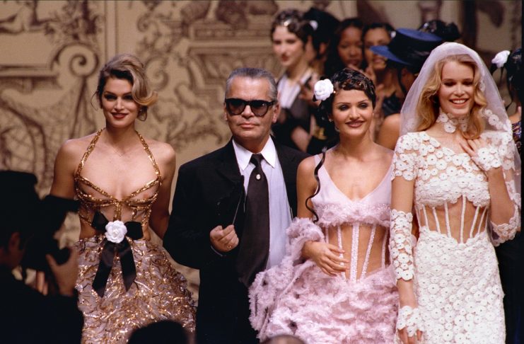 German designer for Chanel fashion house Karl Lagerfeld is surrounded by top models (L-R) American C..