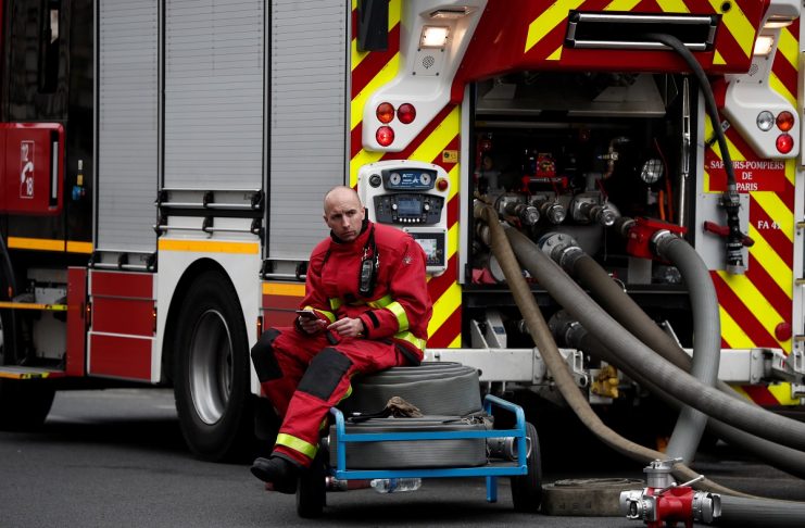 A firefighters works at Notre-Dame Cathedral after a fire devastated large parts of the gothic gem in Paris