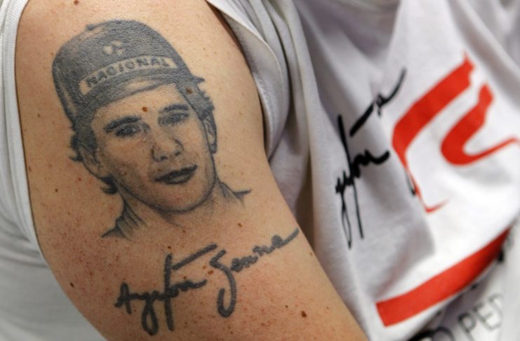 Tattoo depicting Brazilian Formula One driver Ayrton Senna is pictured on a fan’s arm during a mass at the Imola race track