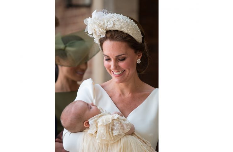 Britain’s Catherine, the Duchess of Cambridge, carries Prince Louis as they arrive for his christening service at the Chapel Royal, St James’s Palace, London
