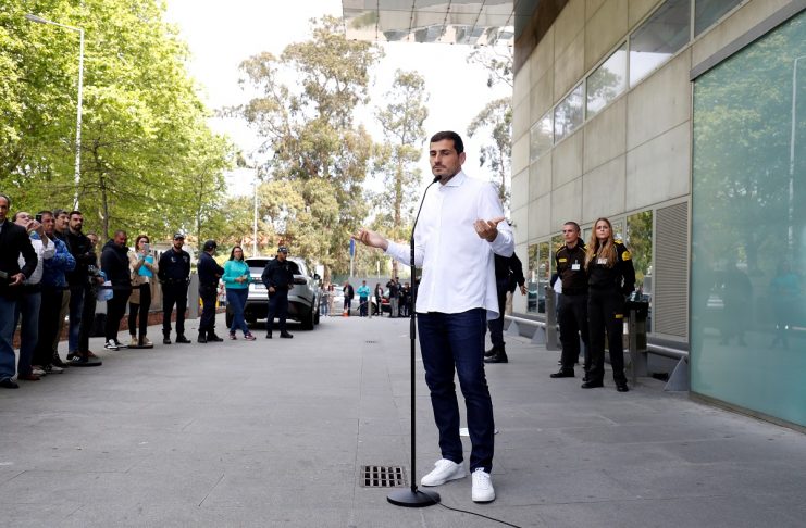 Spanish soccer player Iker Casillas speaks to journalists before he leaves CUF Porto hospital accompanied by his wife Sara Carbonero in Porto