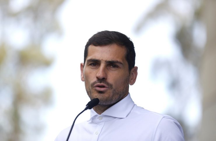 Spanish soccer player Iker Casillas speaks to journalists before he leaves CUF Porto hospital accompanied by his wife Sara Carbonero in Porto