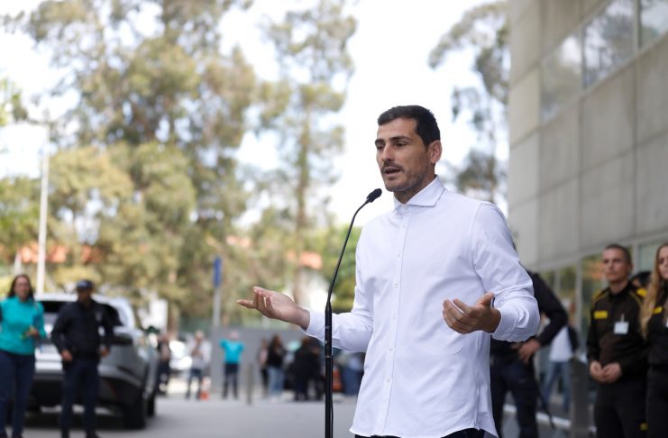 Spanish soccer player Iker Casillas speaks to journalists before he leaves CUF Porto hospital accompanied by his wife Sara Carbonero in Porto