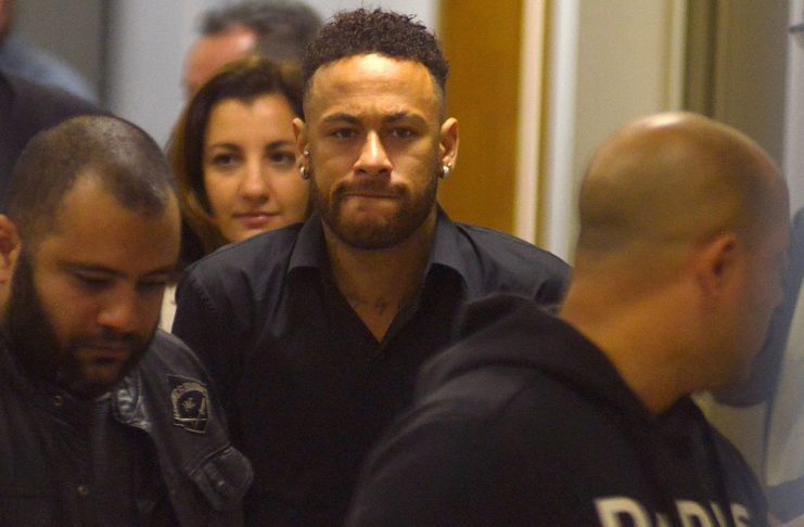 Brazilian soccer player Neymar leaves the police station after testifying in Rio de Janeiro